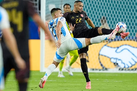 Lautaro Martínez and Alexander Callens battle for the ball